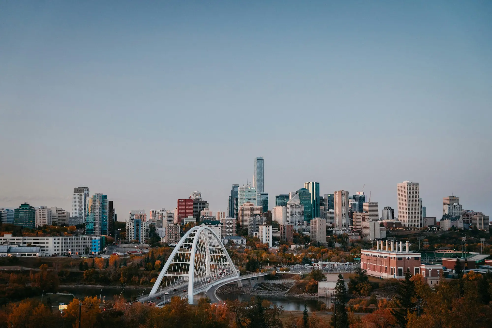 The Edmonton skyline across the river valley, with the Walterdale Bridge in the foreground.
